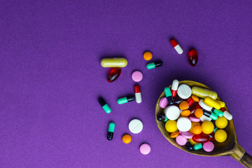 Wooden spoon with pills