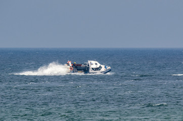 Fototapeta premium PATROL BOAT - Police boat in patrol action at sea