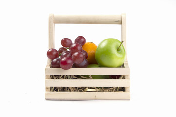 fruit  in basket isolated on white background