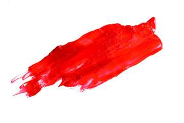 Red smear - lipstick on white background. Beauty and cosmetics background
