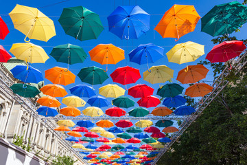 Fototapeta na wymiar Flying umbrellas in Saint-Petersburg, Russia