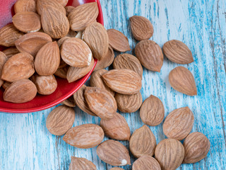 Dried apricots with nuts on wooden table close-up macro shot