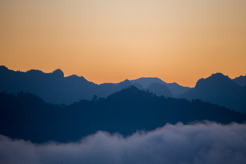 Silhouette layers of mountains in the morning.