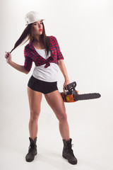 A woman with an electric saw in her hand