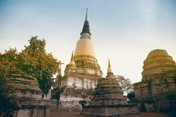 Fototapeta premium Ancient white buddha statues and ruined pagoda at Wat Yai Chai Mongkol in Ayutthaya historic attractions ,Thailand.