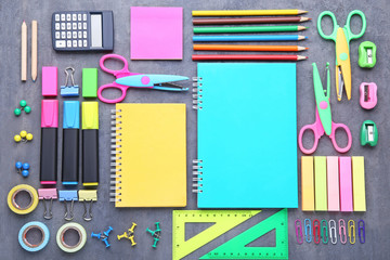 School supplies on grey wooden table