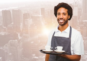 Restaurant owner with coffee cups against blurry skyline