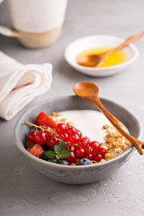 Yogurt bowl with granola and fresh berries