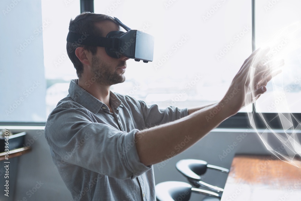 Poster man in vr headset touching a 3d sphere interface