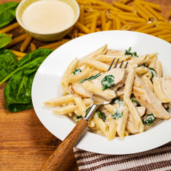 Spinach Chicken Alfredo Parmesan Pasta. Selective focus.