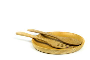 Wooden plate white wooden spoon and wooden fork on white