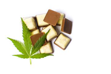 Marijuana leaf on top of chocolate pieces