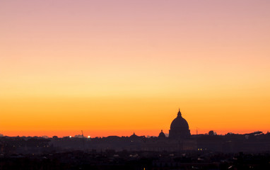 Obraz premium Panorama view of Rome at sunset with St Peter Cathedral