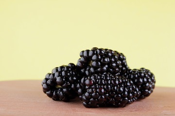 Isolated blackberry on a wooden close-up background