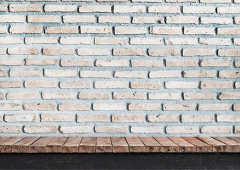 Brick wall on wooden table 