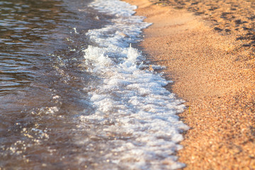 Soft wave of the sea on the sandy beach