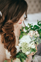 Obraz na płótnie Canvas Bride with a beautiful bouquet of different colors. Close-up