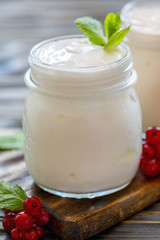 Obraz na płótnie Canvas Homemade yoghurt in a glass jar.