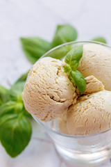 Basil ice cream in a glass bowl.