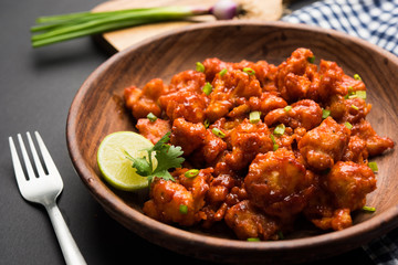 Gobi Manchurian dry - Popular street food of India made of cauliflower florets, selective focus   © StockImageFactory