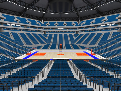 Large modern basketball arena with blue seats