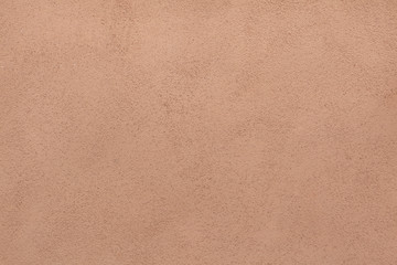 Brown painted stucco wall. Background texture