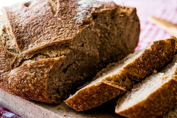 irish soda bread slices on wooden surface.