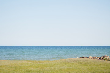 Landscape of the sea, sky without clouds, sea stones