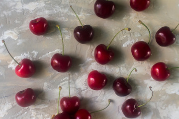 Cherries on light background, delicious cherry berries, top view, selective focus