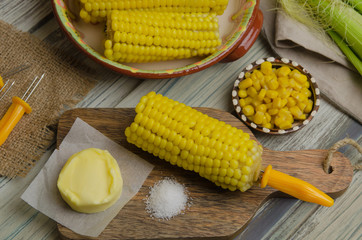 Boiled sweet corn served with salt and butter 