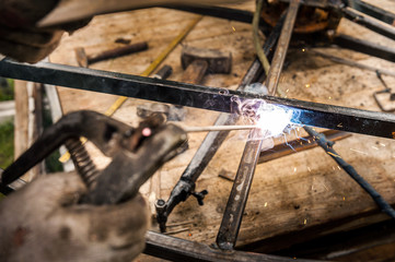 Man welding at his backyard