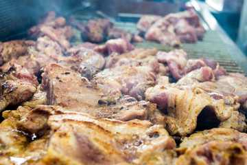 Charcoal-boiled pork neck preparing on the on sieve - street food