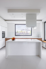 Stylish, white kitchen with island