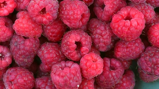 Raspberries. Fresh and juicy raspberry background. Rotation 360 degrees. 4K UHD video 3840X2160