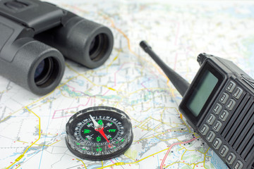 Compass walkie-talkie map and binocular  equipment concept search