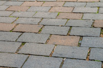 Grey and orange brick stone street sidewalk in berlin