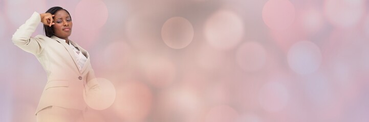 Thinking businesswoman with sparkling lights bokeh transition