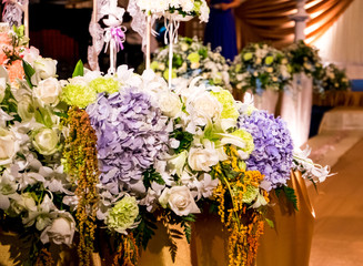 Table setting at a luxury wedding reception party. Beautiful flowers on the table.