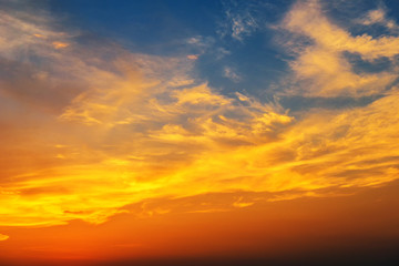Naklejka na ściany i meble Sunset makes the sky and cloud a beautiful golden yellow.