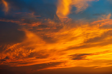 Fototapeta premium Sunset makes the sky and cloud a beautiful golden yellow.