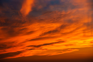 Sunset makes the sky and cloud  a beautiful golden yellow.