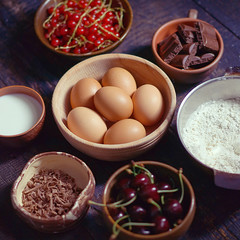 Ingredients for a cake in rustic kitchen