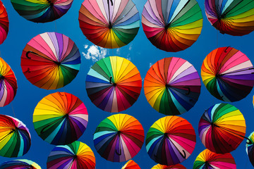Colored umbrellas hung above the street.