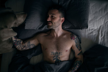 Man with dog on bed