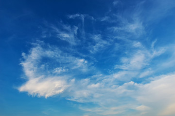 Blue skies with some clouds in the sky is bright.