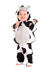 A baby in a fancy dress cow costume on a white background
