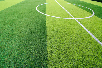 The white Line marking on the artificial green grass soccer field