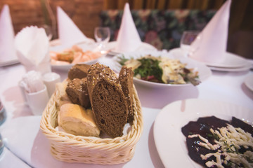Decorated catering banquet table with different food appetizers assortment on a party
