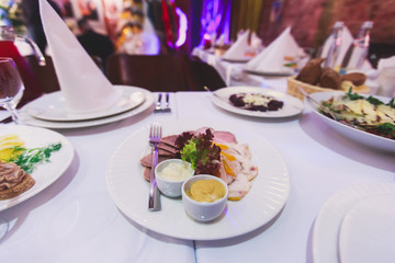 Decorated catering banquet table with different food appetizers assortment on a party
