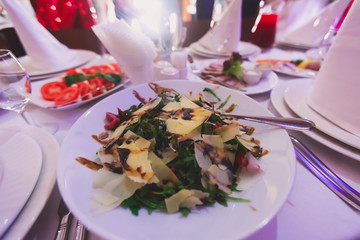 Decorated catering banquet table with different food appetizers assortment on a party
